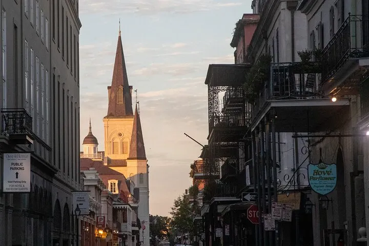 a narrow city street with old buildings in the background