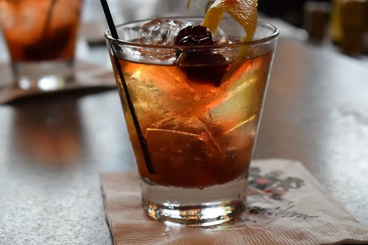 a close up of a glass of beer on a table