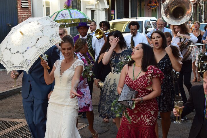 a group of people standing in front of a crowd posing for the camera