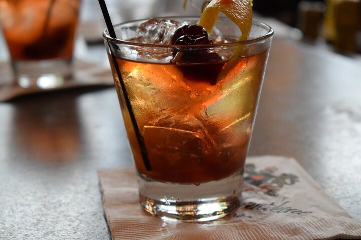 a close up of a glass of beer on a table