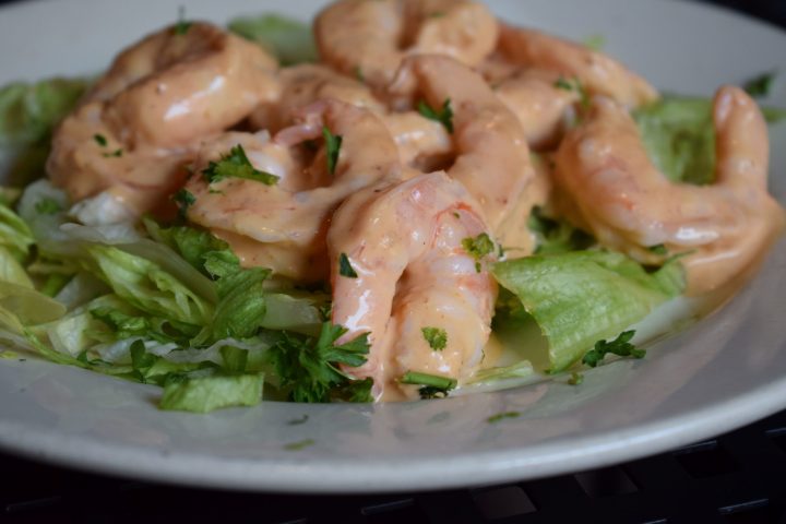 a plate of shrimp and vegetables