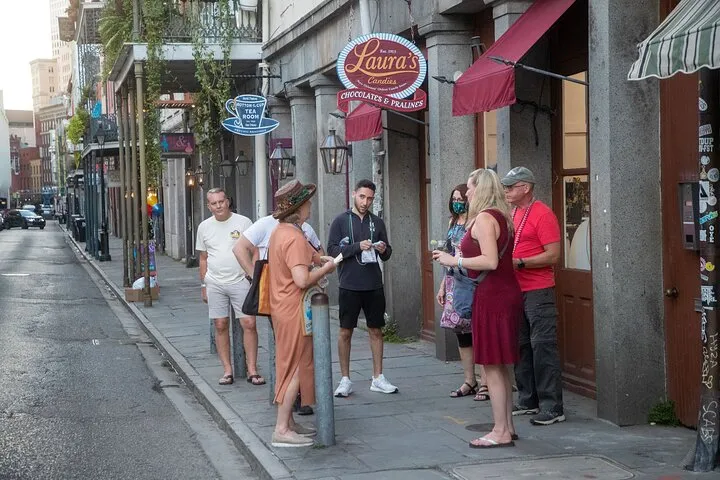 a group of people walking on a city street