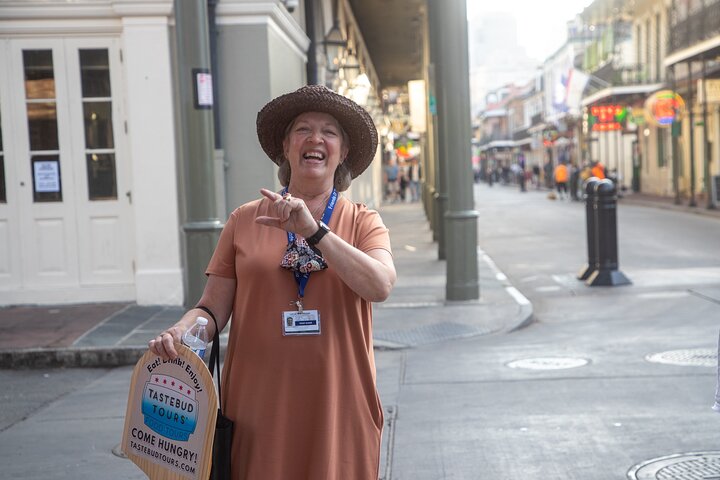 a person on the sidewalk talking on a cell phone