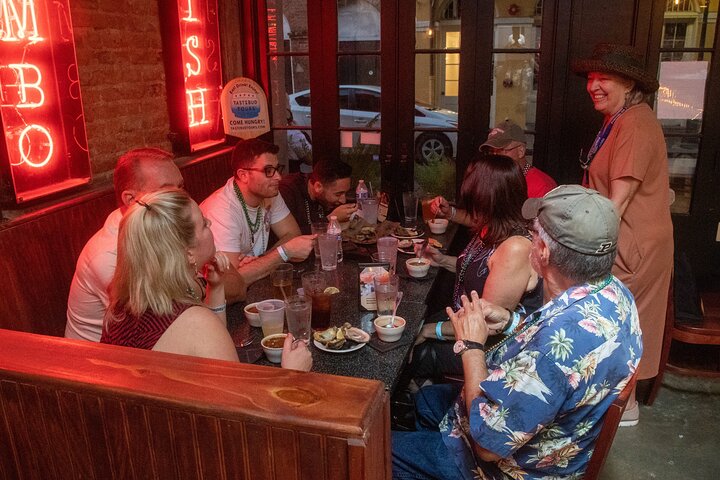 a group of people sitting at a table in a restaurant