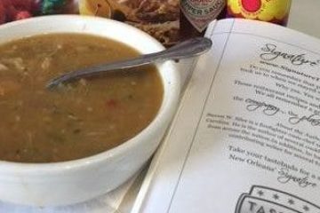 a bottle of beer and a bowl of food