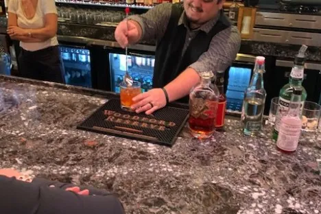 a boy sitting in front of a television