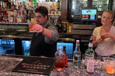 a boy sitting in front of a store