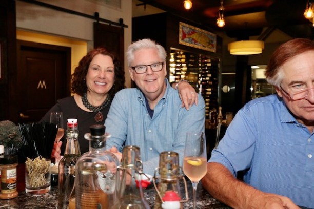Christine Hollinden et al. sitting at a table with wine glasses