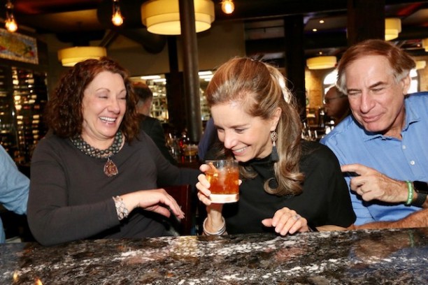 Christine Hollinden et al. sitting at a table eating food