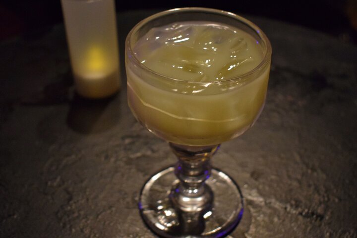 a glass of beer on a table