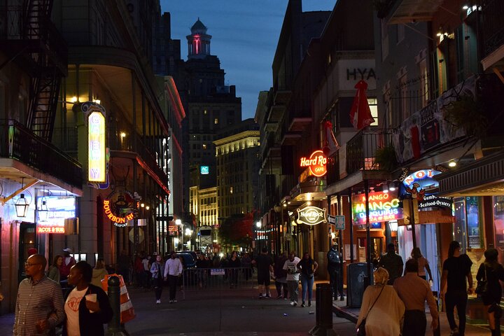 a group of people walking on a city street