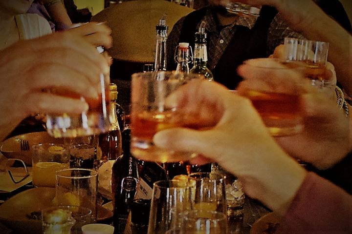 a person holding a wine glass