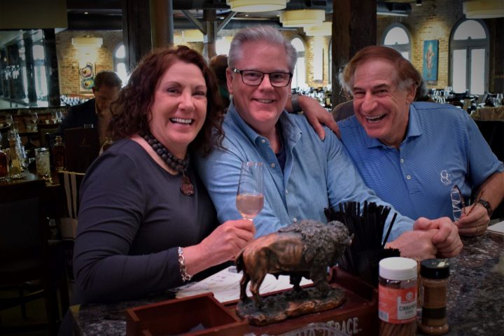Christine Hollinden et al. sitting at a table