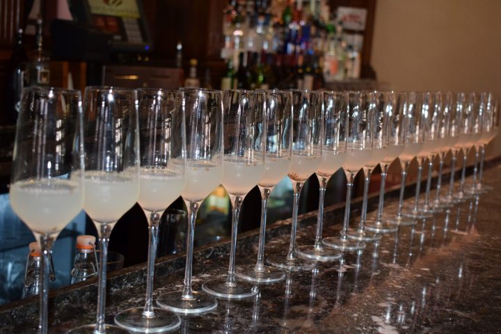 a row of wine glasses on a table