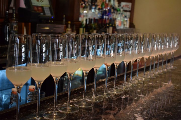 a row of wine glasses on a table