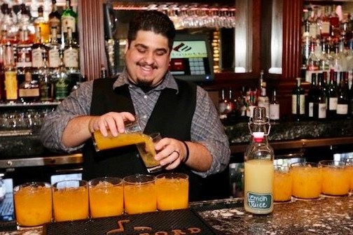 a person sitting at a table in a restaurant