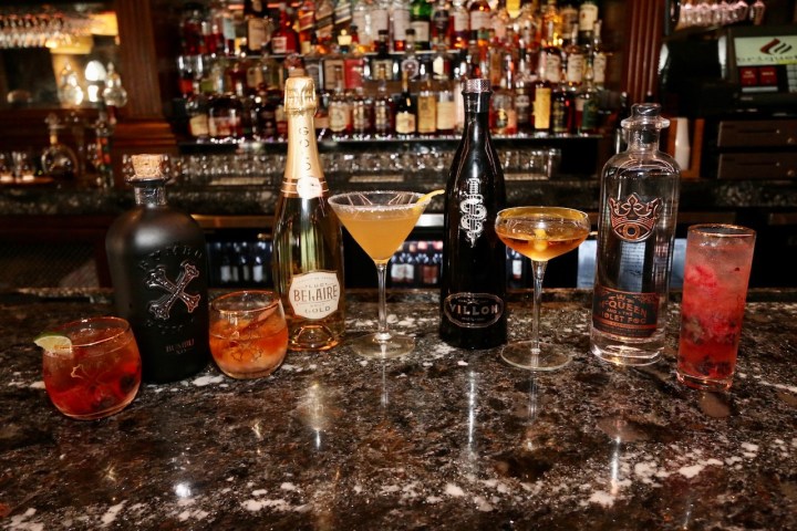 a bottle of wine and a glass of beer on a table