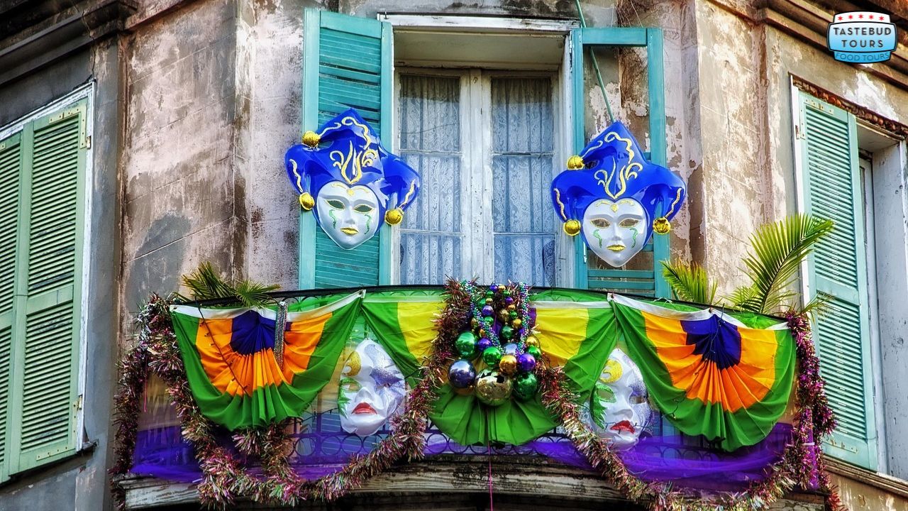 Colorful Mardi Gras balcony with masks, beads, and festive decorations.