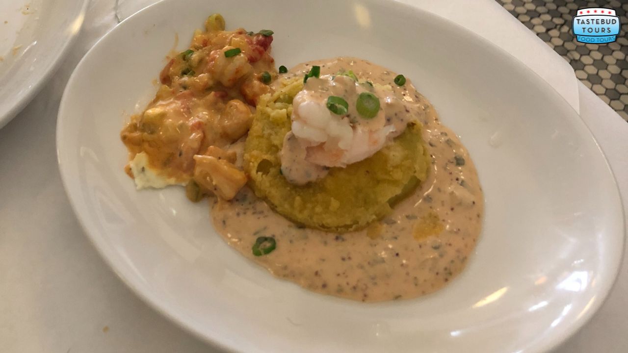 Plate with fried green tomato, shrimp, and sauce, served with lobster mac and cheese.