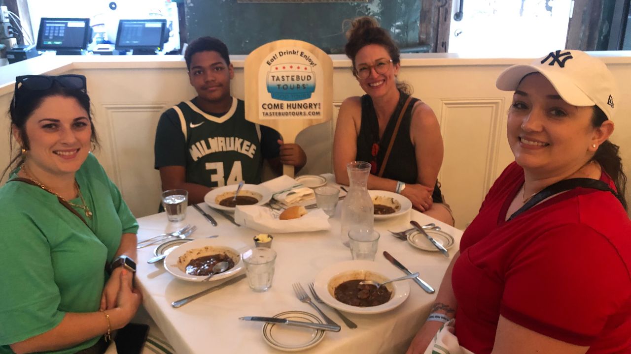 Visitors on local tours discovering the unique flavors of Creole vs Cajun food.