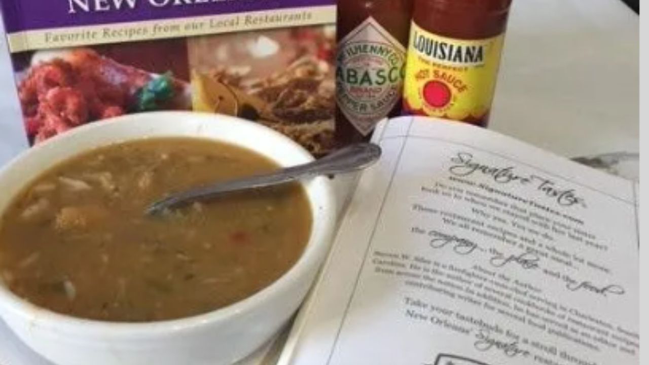 A colorful cover of "The New Orleans Cookbook" featuring iconic dishes and vibrant culinary imagery.  