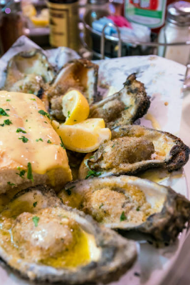 Chargrilled oysters on a table.