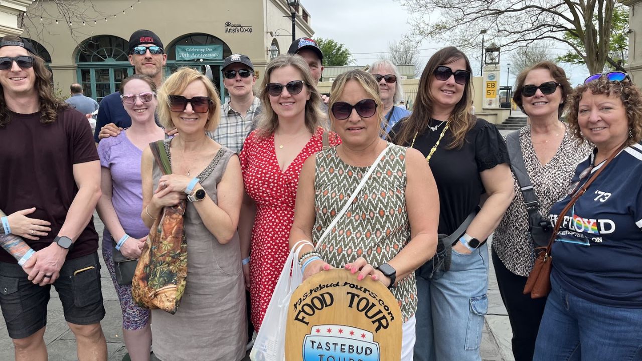 Group on a food tour exploring vegan food in New Orleans in the French Quarter.