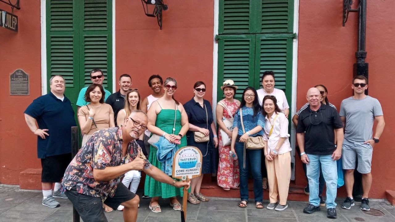 Tastebud Tours team brunch group posing during New Orleans food tour.