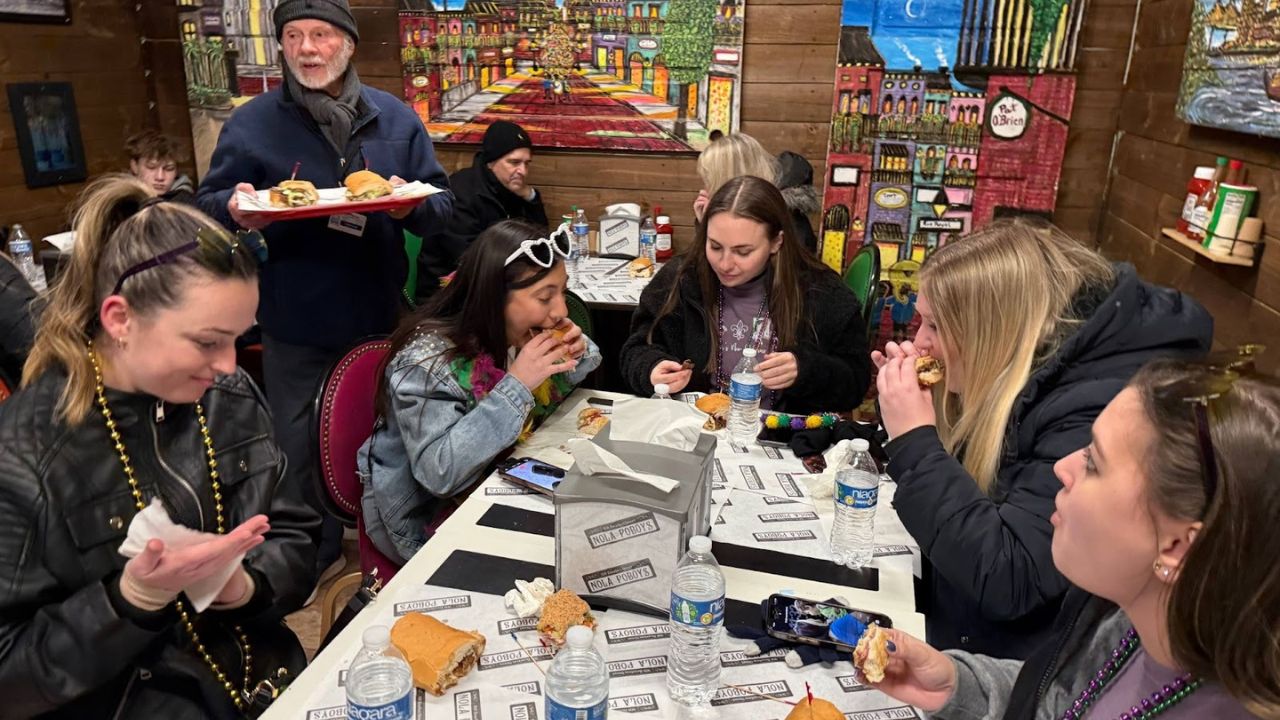 Group of travelers enjoying Cajun food on a food tour.
