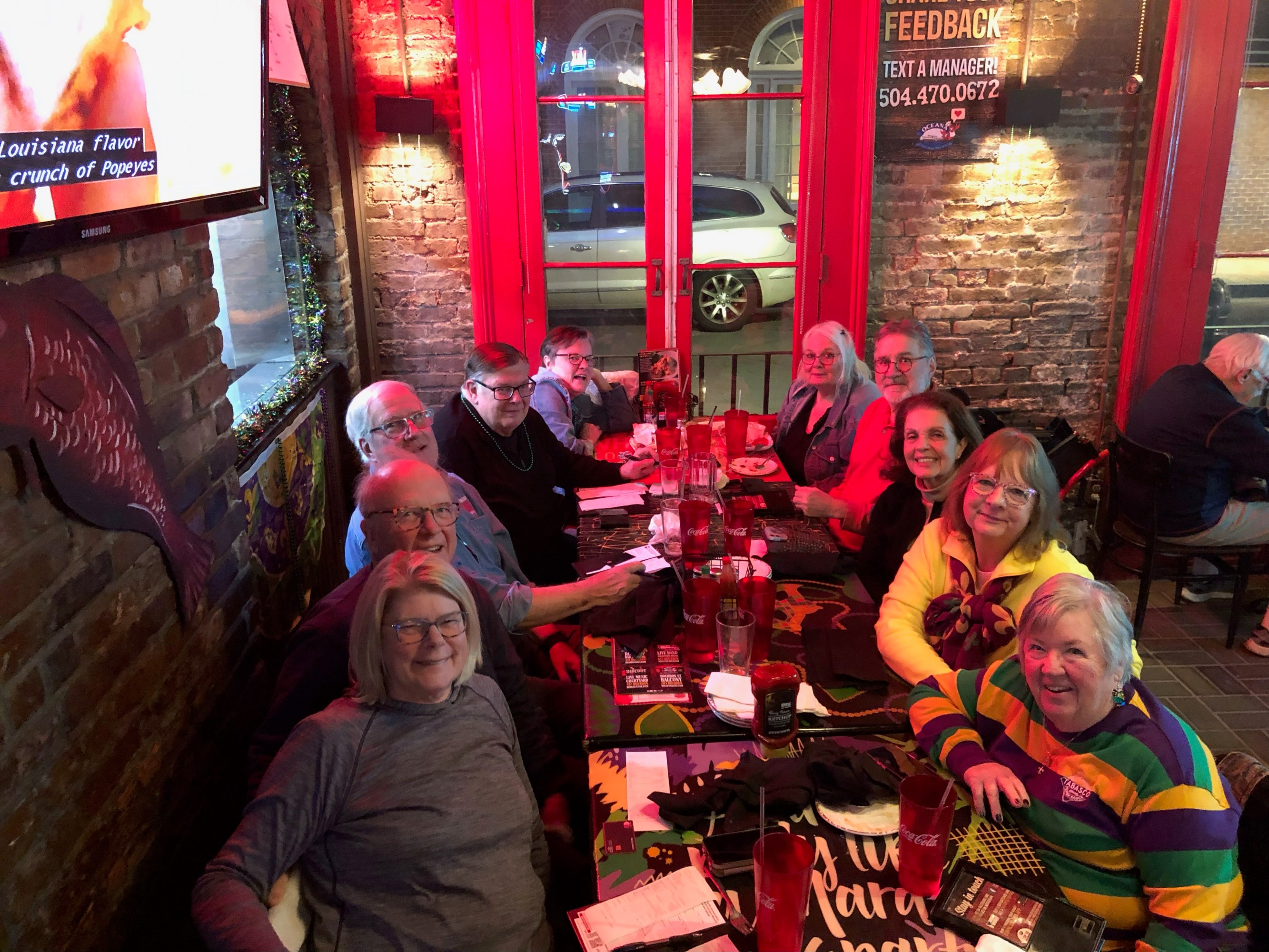 Group enjoying a progressive dinner food tour in New Orleans French Quarter.