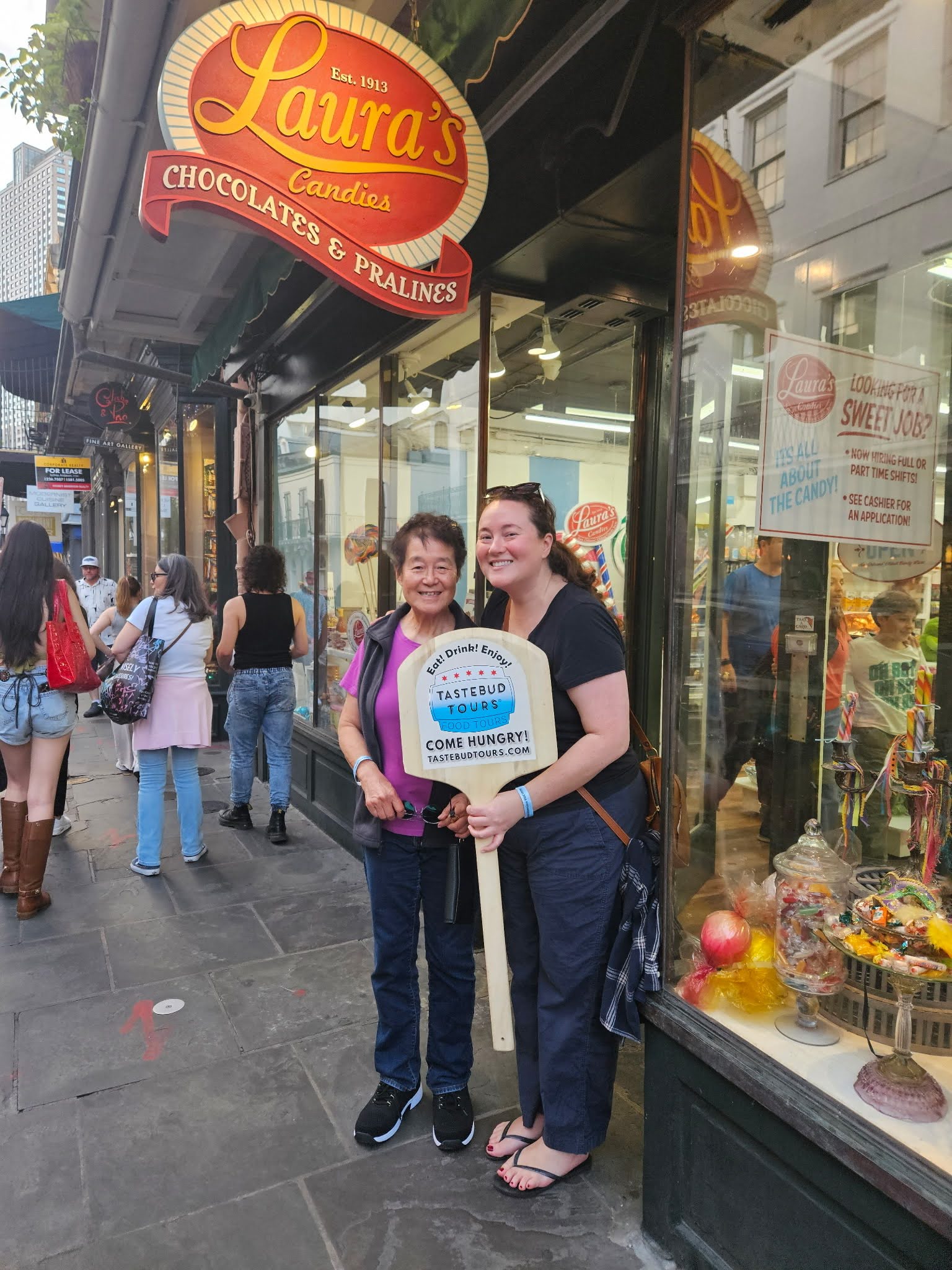 Guests posing in front of Laura’s bakery in New Orleans.