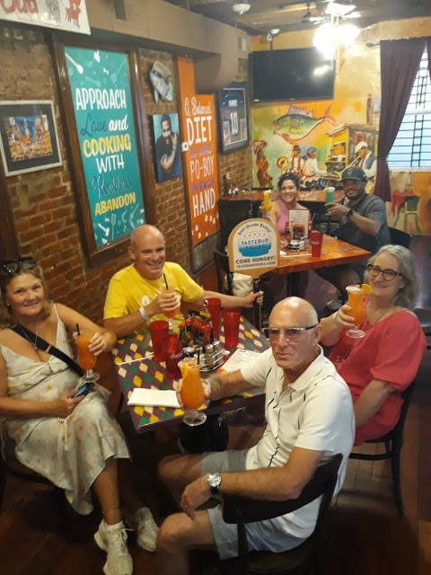 Guided French Quarter cocktail tour group enjoying drinks and local culture