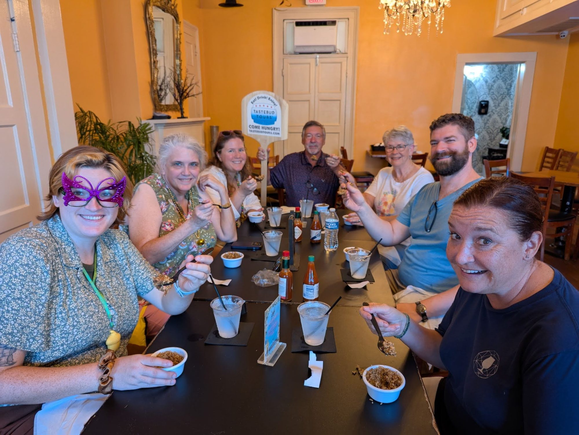 Guests enjoying New Orleans cuisine during a food tour.