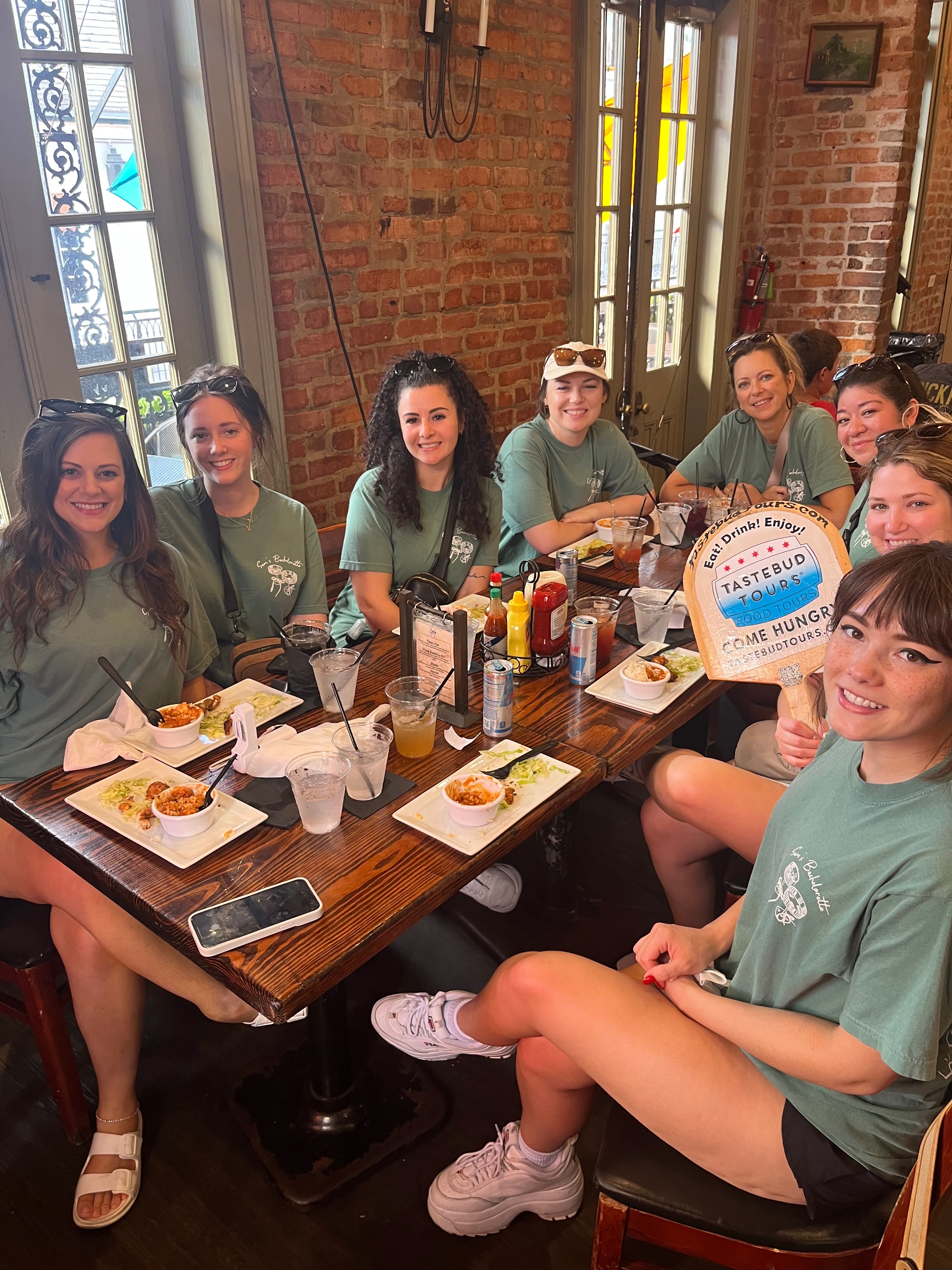 Tourists tasting local New Orleans food during a guided food tour.