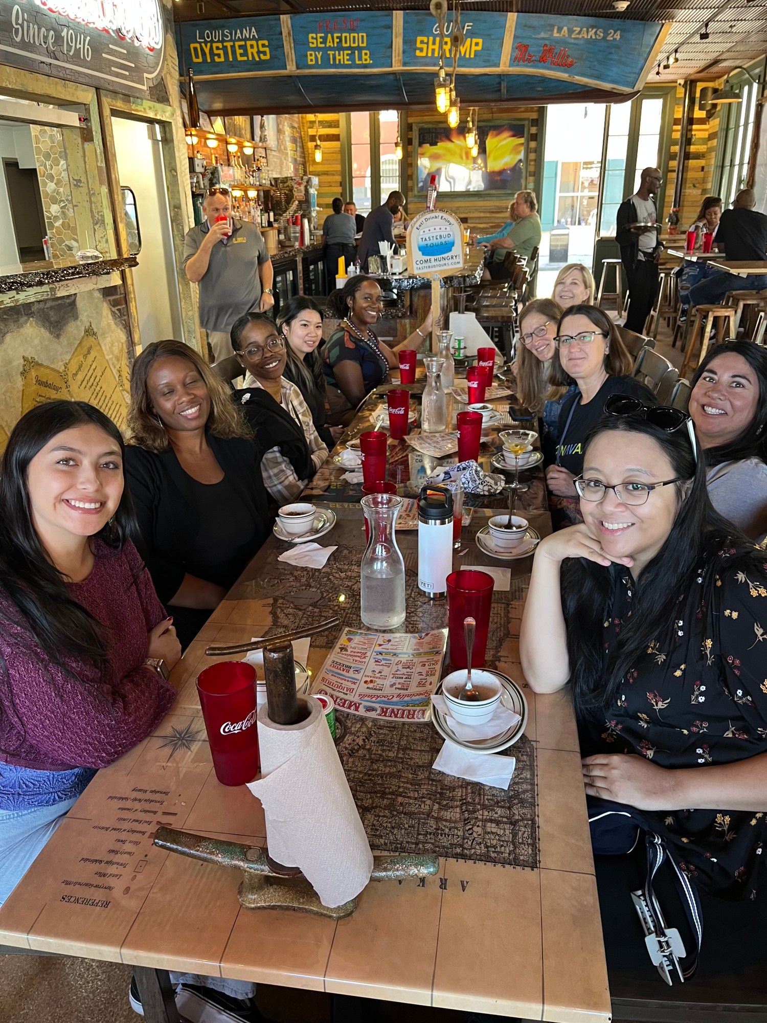 Visitors exploring the French Quarter on a guided New Orleans food tour featuring iconic local dishes.