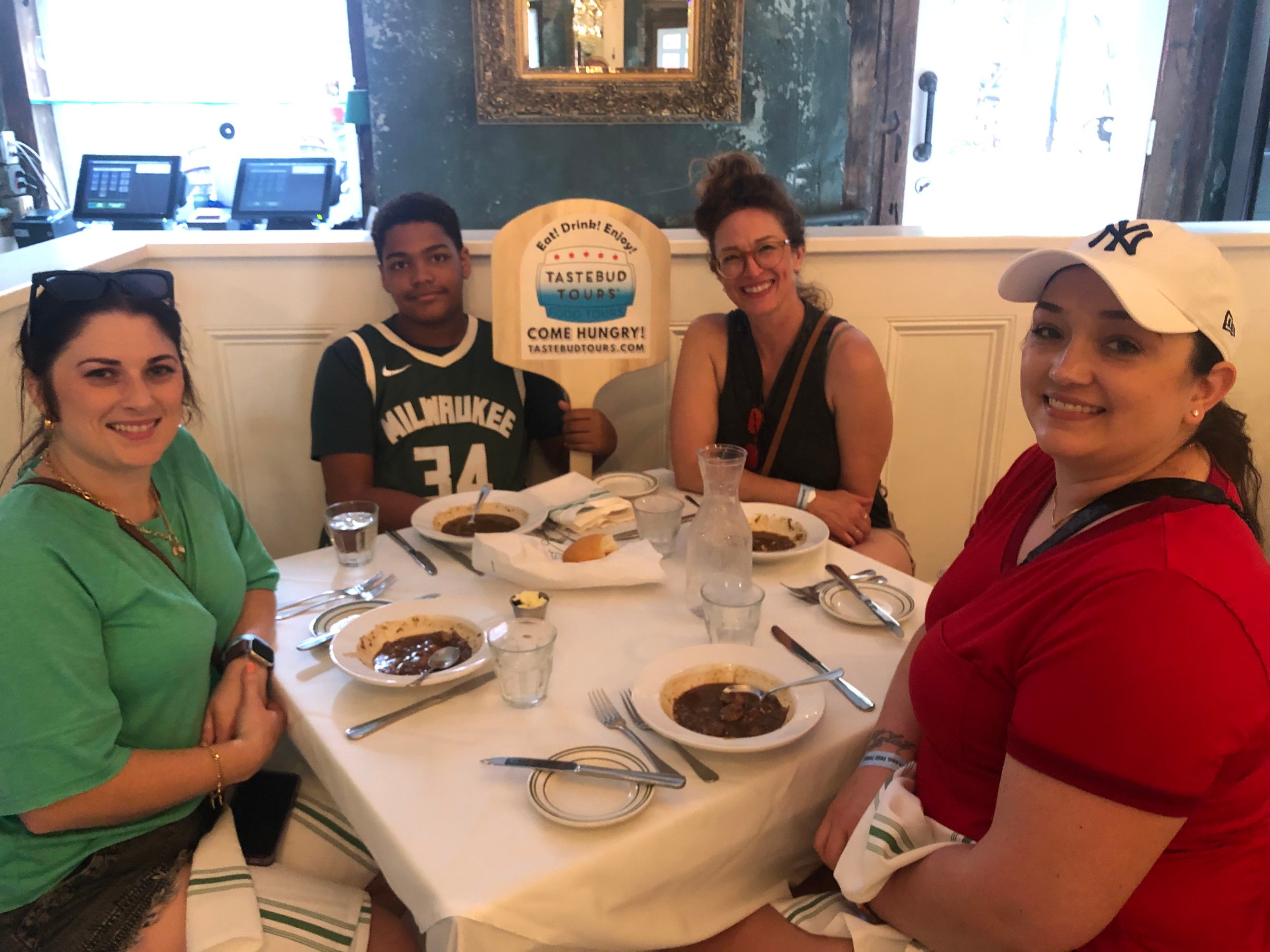 Food tour guests enjoying a meal together in New Orleans.