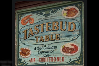 Tastebud Table sign featuring vintage design and New Orleans culinary experience.