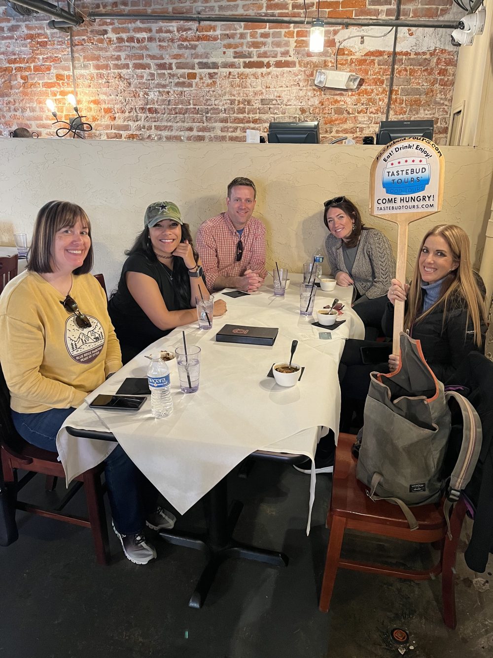 Visitors enjoying a New Orleans culinary experience during a guided food tour.