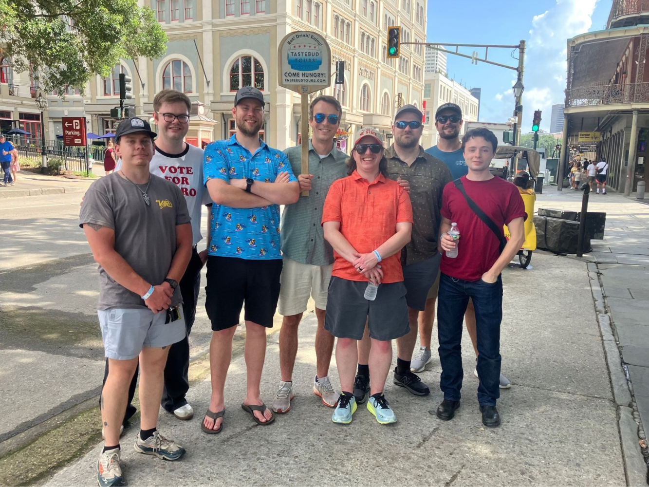 Tastebud Tours group posing on a sunny New Orleans street during a guided French Quarter food tour.