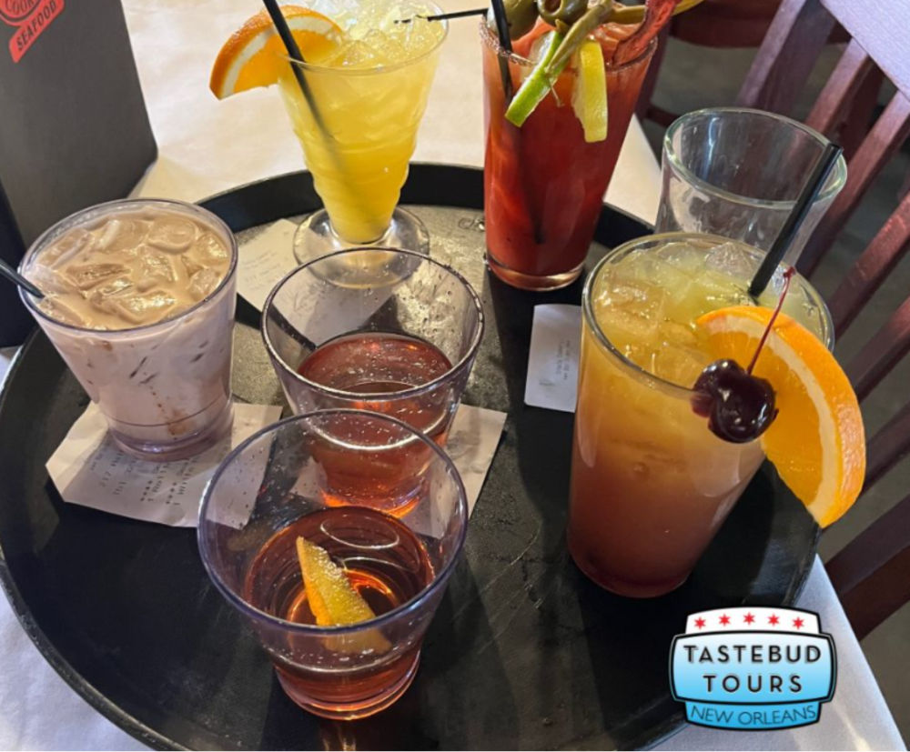 Classic Sazerac, a zesty Hurricane, a chilled Abita and other drinks served during a walking food tour.